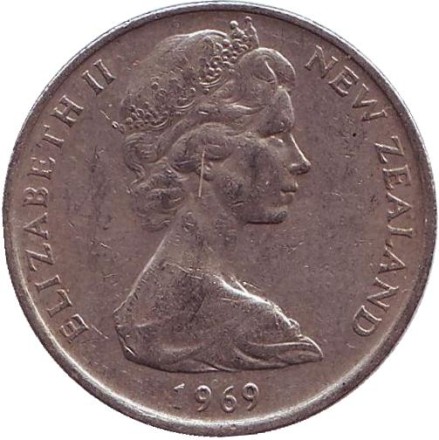 Монета 10 центов. (1 шиллинг). 1969 год, Новая Зеландия. Из обращения. Маска маори. Монета 10 центов. (1 шиллинг). 1969 год, Новая Зеландия. Из обращения. Маска маори.