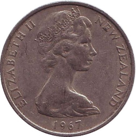 Монета 10 центов. (1 шиллинг). 1967 год, Новая Зеландия. Из обращения. Маска маори. Монета 10 центов. (1 шиллинг). 1967 год, Новая Зеландия. Из обращения. Маска маори.