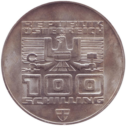 Монета 100 шиллингов. 1975 год, Австрия. XII зимние Олимпийские Игры. Инсбрук 1976. Здание и Олимпийская эмблема. (Отметка - щит).