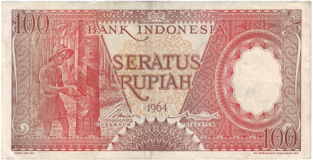Банкнота 100 рупий. 1964 год, Индонезия. Тип 1. Рабочий на каучуковой плантации.