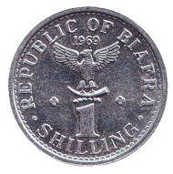 Монета 1 шиллинг. 1969 год, Биафра. (Нигерия). Надпись: "1 shilling" Монета 1 шиллинг. 1969 год, Биафра. (Нигерия). Надпись: "1 shilling"