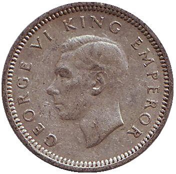 Монета 3 пенса. 1944 год, Новая Зеландия. Скрещенные вахаики.