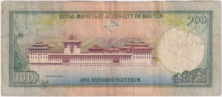 Банкнота 100 нгултрумов. 2000 год, Бутан. Монастырь Ташичо-дзонг.