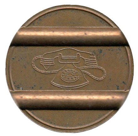 Телефонный жетон. 7703. Италия. 1977 год. (Отметка: IPM) Телефонный жетон. 7703. Италия. 1977 год. (Отметка: IPM)