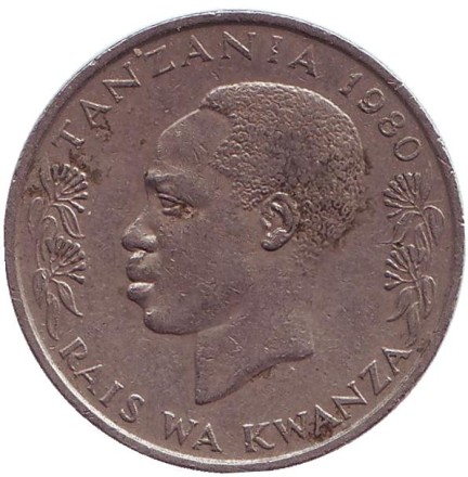 Монета 1 шиллинг. 1980 год, Танзания. Президент Али Хассан Мвиньи. Факел.