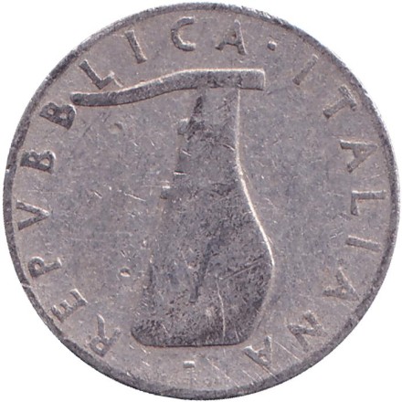 Монета 5 лир. 1951 год, Италия. Дельфин. Судовой руль. Монета 5 лир. 1951 год, Италия. Дельфин. Судовой руль.