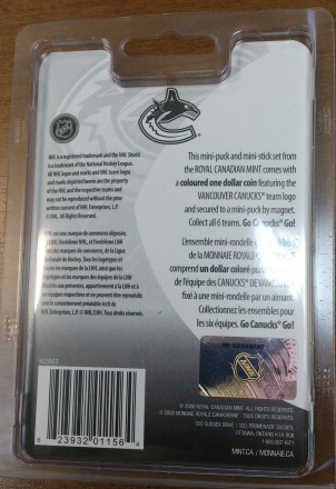 Монета 1 доллар. 2009 год, Канада. Хоккейный клуб "Ванкувер Кэнакс". (В брелоке-шайбе, с мини-клюшкой). Монета 1 доллар. 2009 год, Канада. Хоккейный клуб "Ванкувер Кэнакс". (В брелоке-шайбе, с мини-клюшкой).