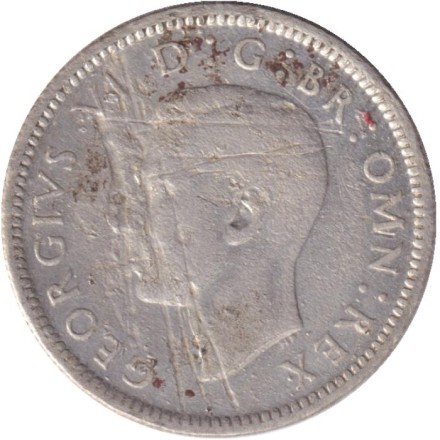 Монета 6 пенсов. 1942 год, Великобритания.