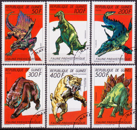 Марки почтовые. Серия из 6 штук. 1987 год, Гвинея. Доисторические животные, рептилии, динозавры.